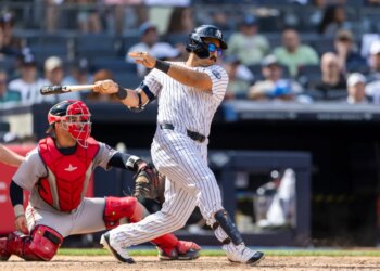 New York Yankees center fielder Trent Grisham (12) hits a RBI single driving home New York Yankees third baseman Amed Rosario (14) in the eighth inning against the Boston Red Sox at Yankee Stadium, Sunday, June 7, 2026, in Bronx, NY.