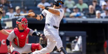 New York Yankees center fielder Trent Grisham (12) hits a RBI single driving home New York Yankees third baseman Amed Rosario (14) in the eighth inning against the Boston Red Sox at Yankee Stadium, Sunday, June 7, 2026, in Bronx, NY.