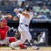 New York Yankees center fielder Trent Grisham (12) hits a RBI single driving home New York Yankees third baseman Amed Rosario (14) in the eighth inning against the Boston Red Sox at Yankee Stadium, Sunday, June 7, 2026, in Bronx, NY.