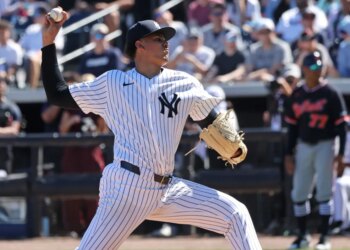 Yankees highly touted prospect throws a pitch during spring training.