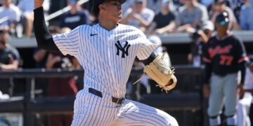 Yankees highly touted prospect throws a pitch during spring training.