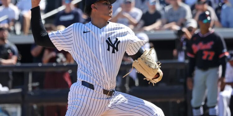 Yankees highly touted prospect throws a pitch during spring training.