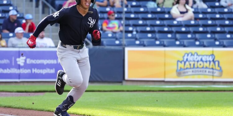 George Lombard Jr., running the bases during a Triple-A game earlier this season, "sprained a couple fingers" after jamming his left hand into a base stealer while covering second base during Tuesday's game.