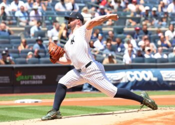 New York Yankees pitcher Carlos Rodón (55) pitches in the first inning.