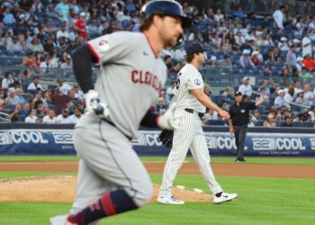 New York Yankees pitcher Gerrit Cole walking off the mound after giving up a home run.