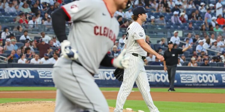 New York Yankees pitcher Gerrit Cole walking off the mound after giving up a home run.