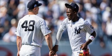 New York Yankees first baseman Paul Goldschmidt (48) celebrates with second baseman Jazz Chisholm Jr. (13).
