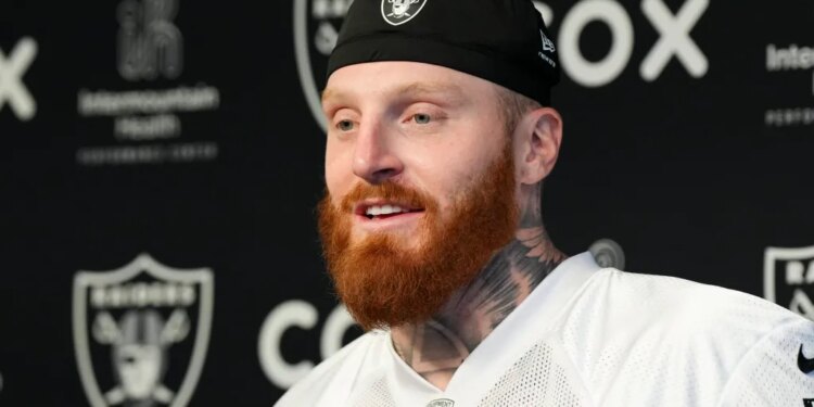Maxx Crosby speaking at a press conference.