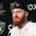 Maxx Crosby speaking at a press conference.