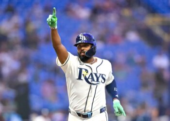 Tampa Bay Rays third baseman Junior Caminero (13) celebrates a home run.