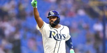 Tampa Bay Rays third baseman Junior Caminero (13) celebrates a home run.