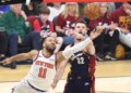 New York Knicks guard Jalen Brunson (11) shoots as Cleveland Cavaliers forward Dean Wade (32) defends during the first quarter.