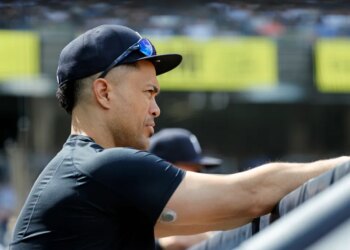 New York Yankees Giancarlo Stanton in the dugout.