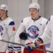 New York Rangers Development Camp players Drew Fortescue and Alberts Smits in white jerseys.