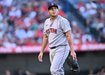 Ranger Suarez, Boston Red Sox pitcher, walks toward the dugout after the first inning of a game.