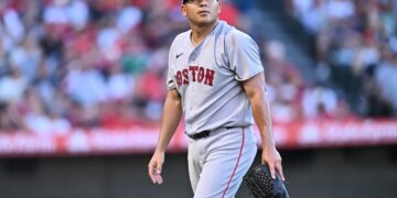 Ranger Suarez, Boston Red Sox pitcher, walks toward the dugout after the first inning of a game.