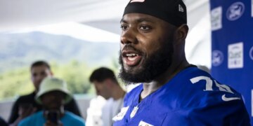 Giants star offensive tackle Andrew Thomas talks to the media during the team's training camp practice on July 20, 2026 in White Sulpher Spring, W.Va.