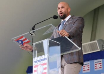 Carlos Beltrán speaking at the National Baseball Hall of Fame induction ceremony.