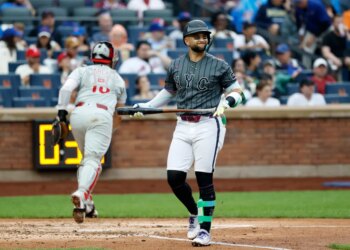 New York Mets shortstop Bo Bichette reacting after striking out swinging.