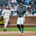 New York Mets shortstop Bo Bichette reacting after striking out swinging.