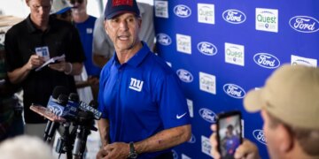 New York Giants head coach John Harbaugh speaks to the media at training camp.