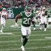 Jets running back Breece Hall (20) runs for a touchdown.
