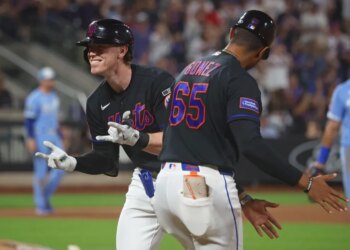 New York Mets third baseman Brett Baty smiling as he celebrates a 2-run RBI during the eighth inning.