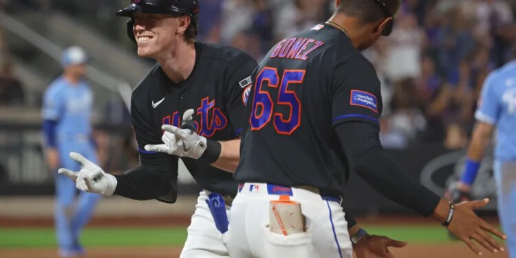 New York Mets third baseman Brett Baty smiling as he celebrates a 2-run RBI during the eighth inning.