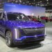 The 2026 Cadillac Vistiq in a vibrant blue color is displayed at the 2025 Detroit Auto Show.