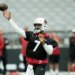 Arizona Cardinals quarterback Jacoby Brissett throwing a football during practice.