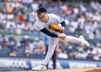 New York Yankees pitcher Clarke Schmidt throws a pitch against the Athletics.