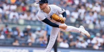 New York Yankees pitcher Clarke Schmidt throws a pitch against the Athletics.