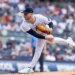 New York Yankees pitcher Clarke Schmidt throws a pitch against the Athletics.