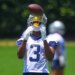 Cowboys receiver George Pickens catches a ball.