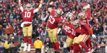 San Francisco 49ers players celebrating a touchdown during the NFC Championship game.