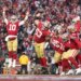 San Francisco 49ers players celebrating a touchdown during the NFC Championship game.