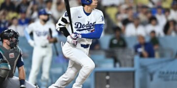 Shohei Ohtani rips an RBI double during the Dodgers' 7-6 loss to the Mariners on July 28, 2026 in Los Angeles.
