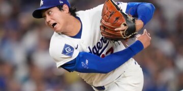 Shohei Ohtani pitching in a Dodgers uniform.