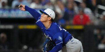 Yoshinobu Yamamoto pitches during a baseball game.