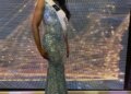 LaToya Malcolm in a sequined gown and a "Miss Universe Jamaica" sash.