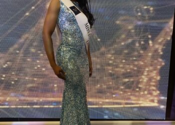 LaToya Malcolm in a sequined gown and a "Miss Universe Jamaica" sash.