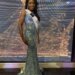 LaToya Malcolm in a sequined gown and a "Miss Universe Jamaica" sash.