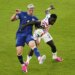 Folarin Balogun (US) fouls Tarik Muharemovic (Bosnia) during a World Cup soccer match.