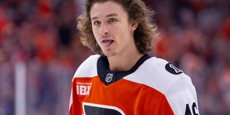 Philadelphia Flyers center Trevor Zegras looks on.