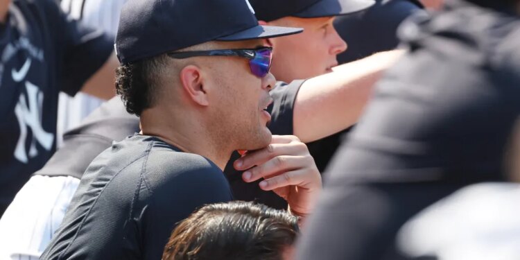 New York Yankees player Giancarlo Stanton in the dugout.