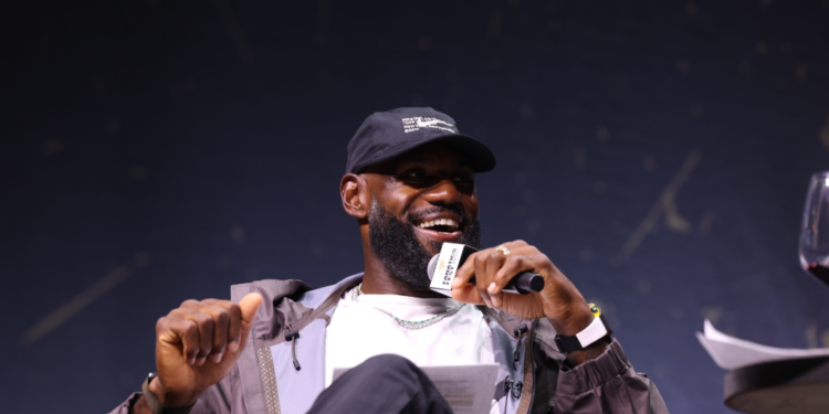 LeBron James speaking into a microphone at Fanatics Fest NYC.