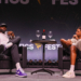 LeBron James and Tyrese Haliburton sitting in armchairs on stage at Fanatics Fest NYC.
