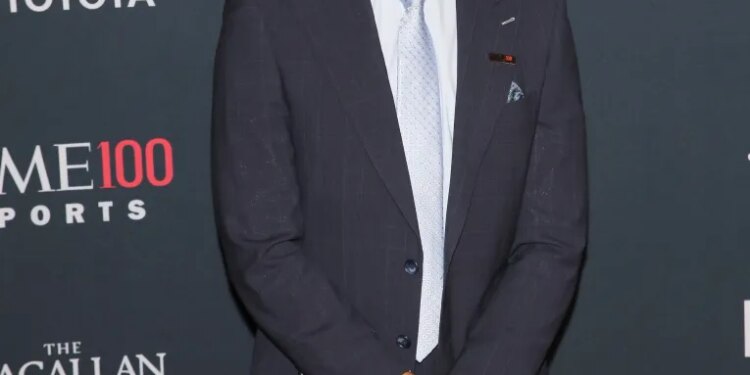 Shams Charania standing at the TIME 100 Sports Gala.