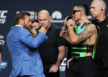 Conor McGregor and Max Holloway face off at the UFC 329 press conference.