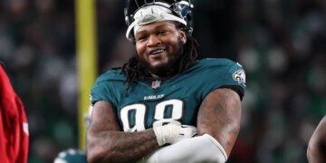 Philadelphia Eagles defensive tackle Jalen Carter (98) looks on between plays during the second half of an NFL wild card playoff football game against the San Francisco 49ers on Sunday, January 11, 2026, in Philadelphia.